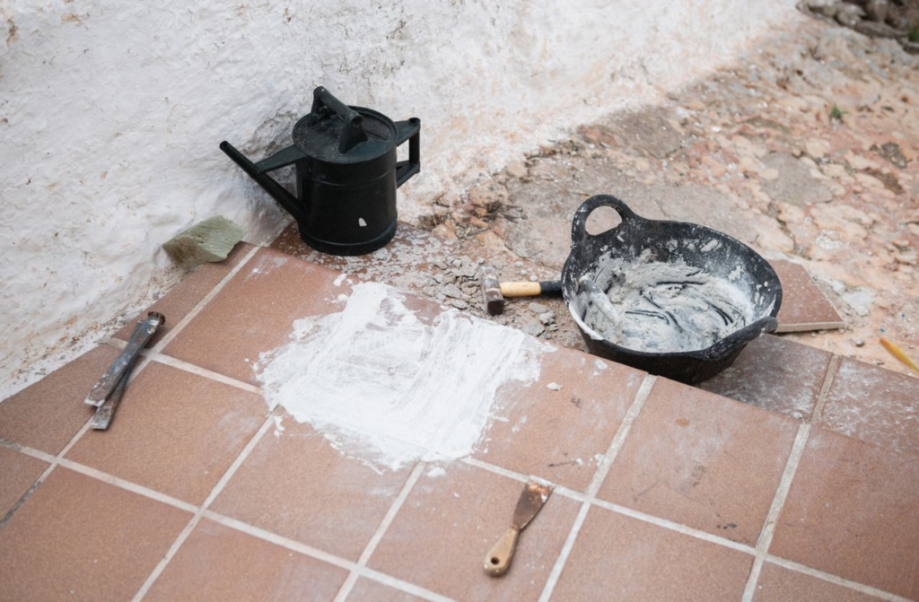 Construction tools and materials on tiled floor, Ciutadella de Menorca, Balearic Islands.